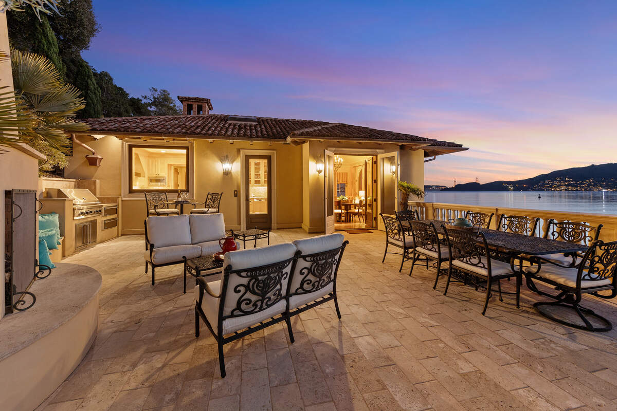 Decks at the Belvedere Island villa overlook San Francisco Bay, with views of the Golden Gate Bridge and the San Francisco skyline.